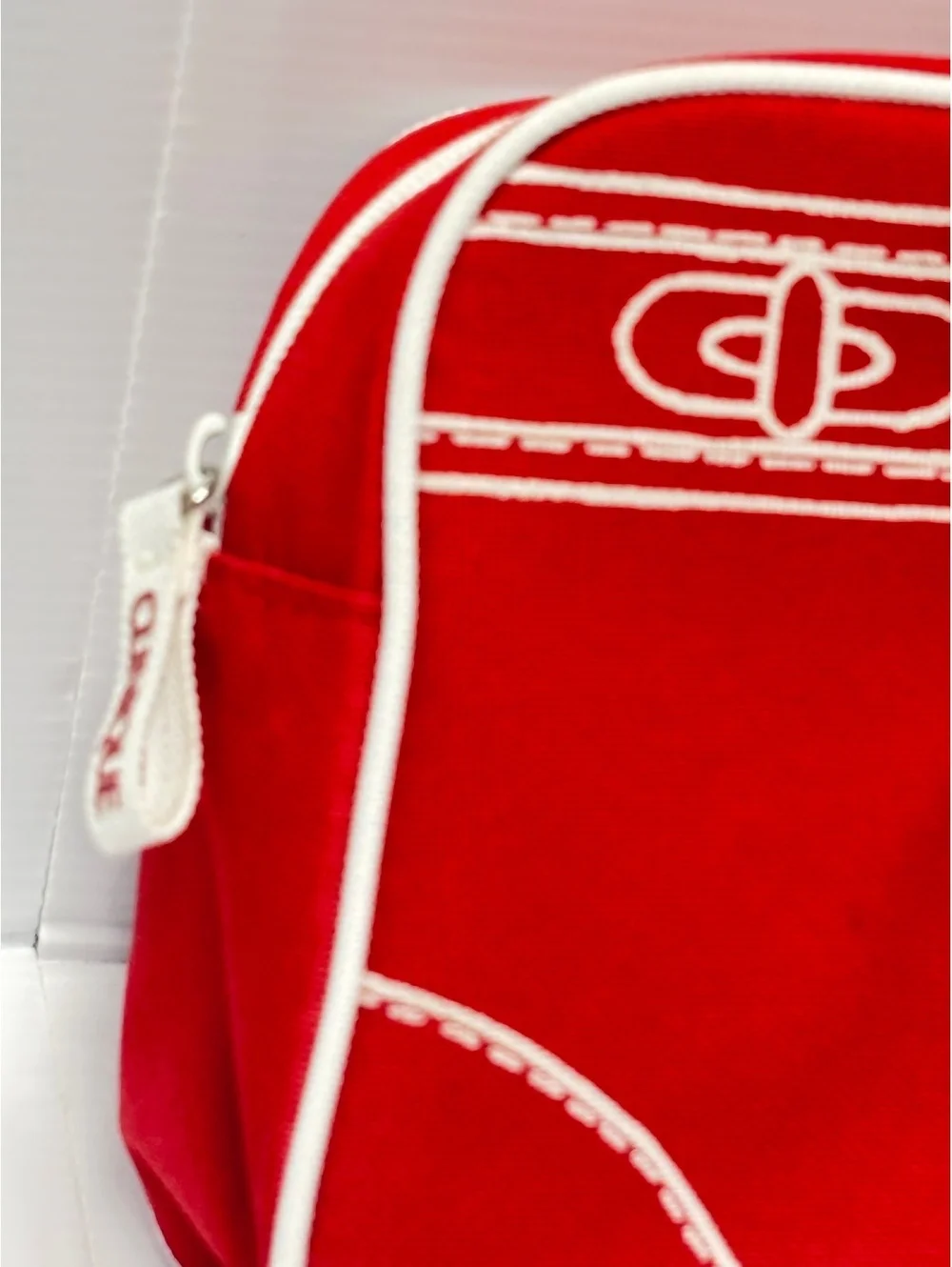 Clinique Red Canvas Cosmetic Bag with White Image Stitching and Zipper Closure
